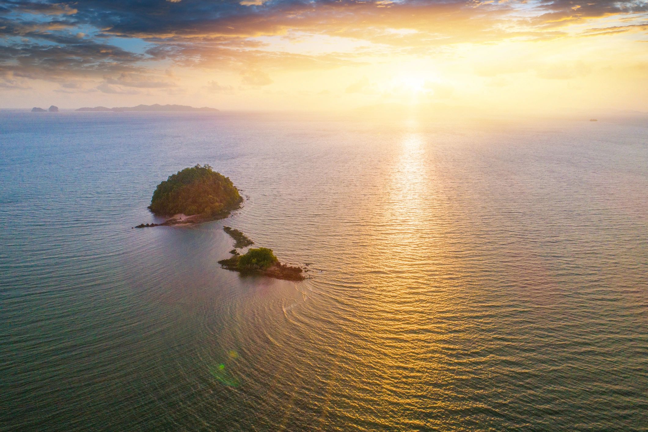 Aerial view of a tropical beach at sunset