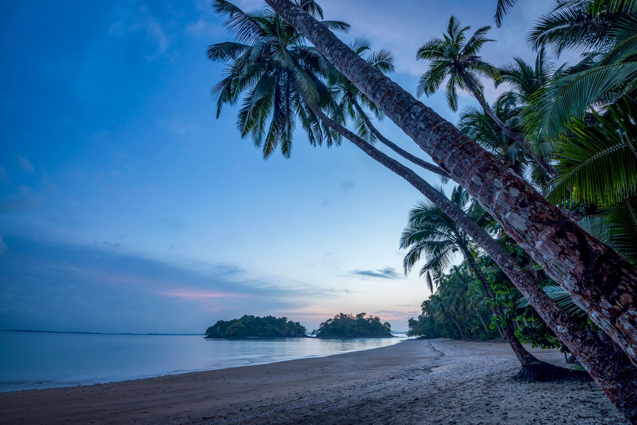 Sunrise over a pebble-and-sand Pacific beach in Panama