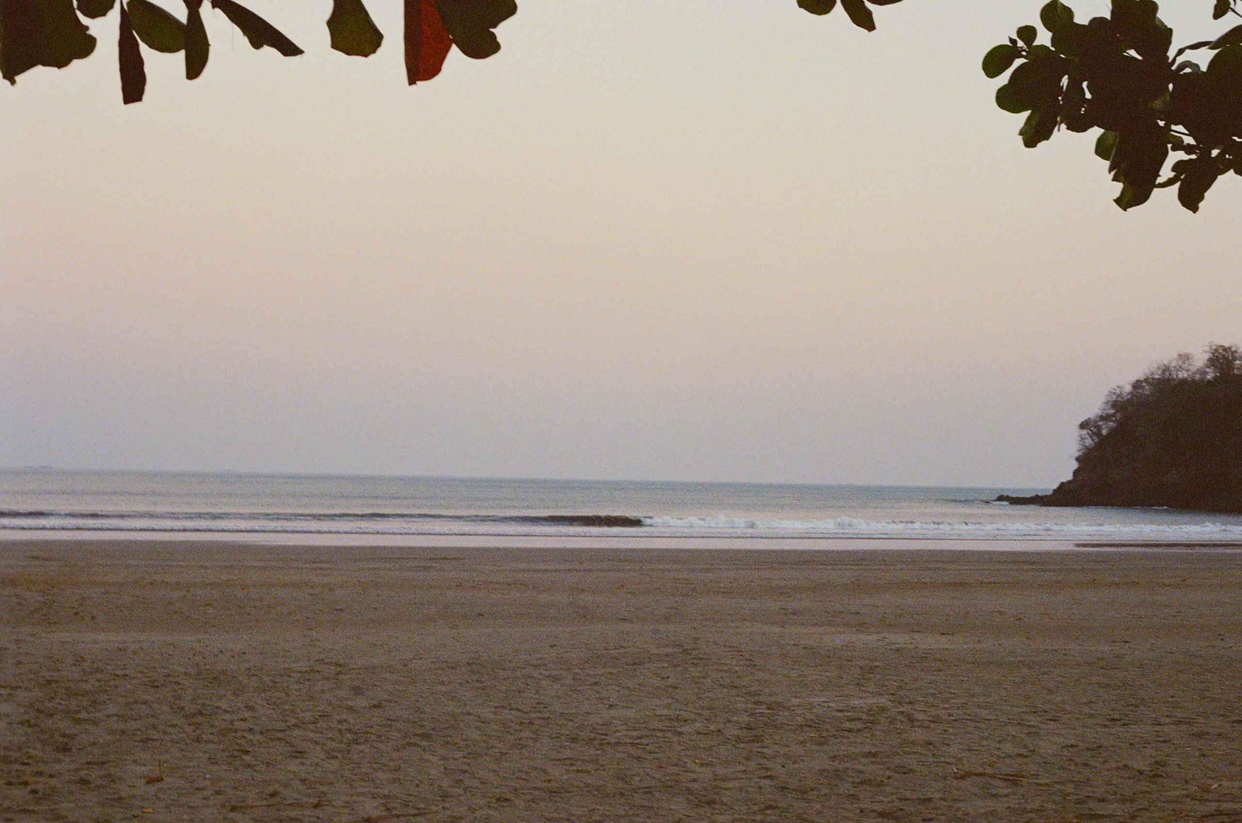 Peaceful beach at dusk with gentle waves
